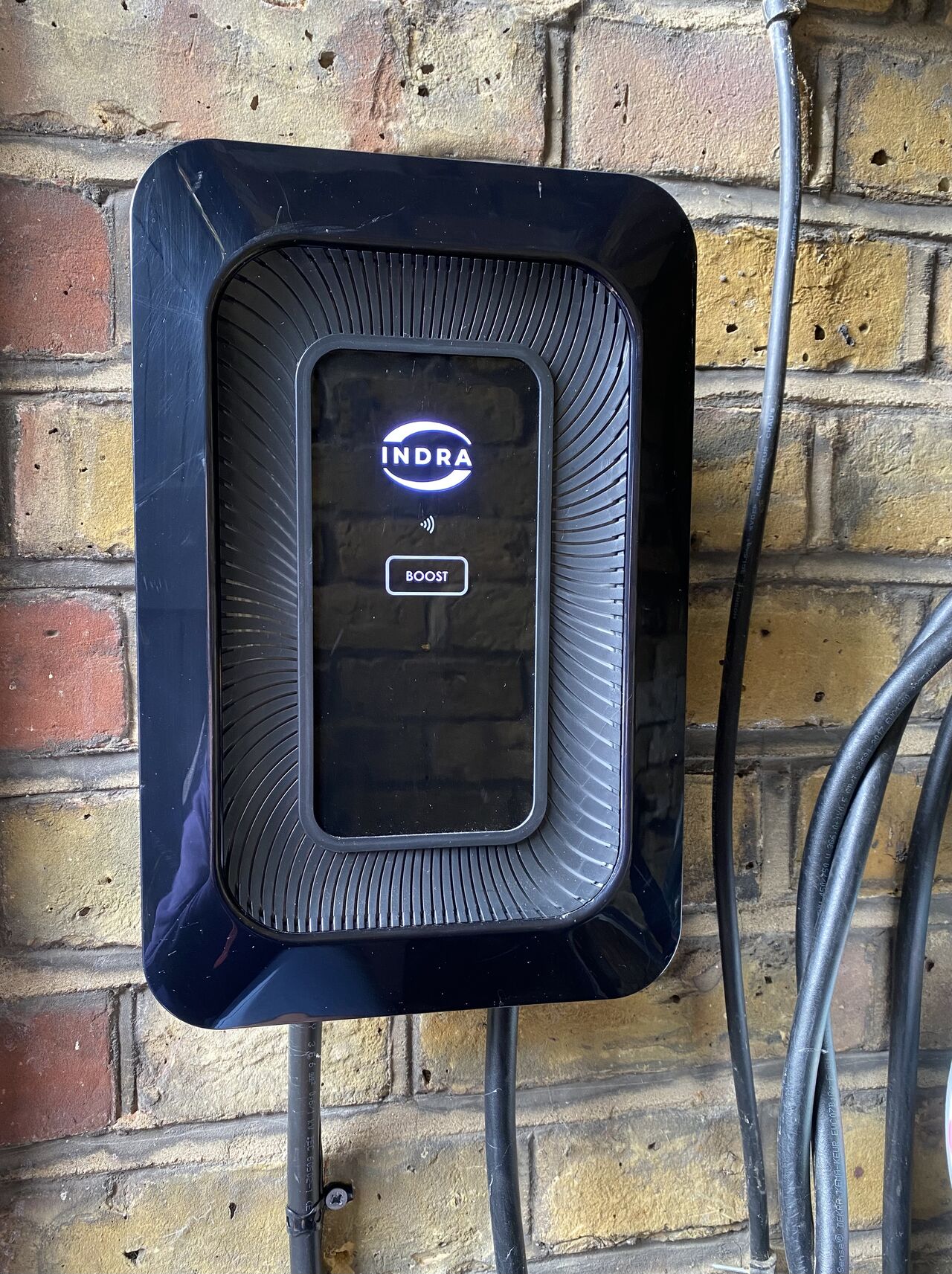 A black Indra smart LUX on a wall